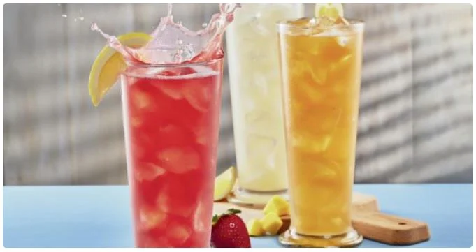 Cold lemonades and iced teas served with ice and lemon slices