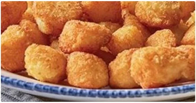biscuit served with honey butter and side sauces.