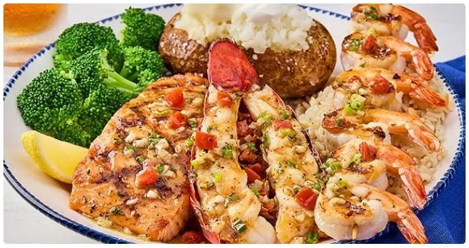 large dinner feast with roasted meats and fresh vegetables