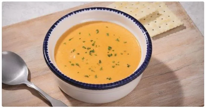 bowl of hot soup served with side dishes