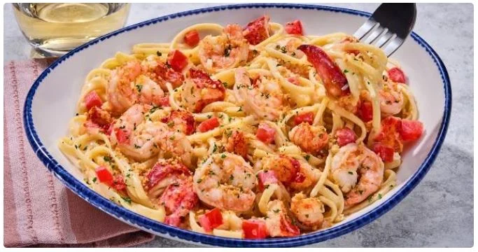 freshly cooked pasta with vegetables and herbs