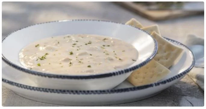 classic soup served with crispy side snacks.